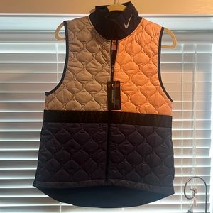 Blue, gray, and pink insulation vest by Nike. Never worn
